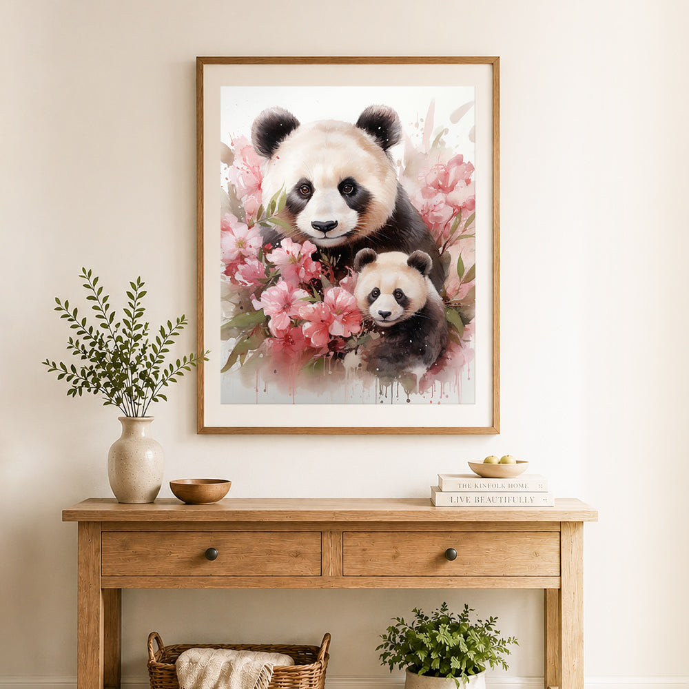 Finished cherry blossom panda pair cross stitch artwork displayed as home decor