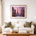 Finished cherry blossoms and eiffel tower in paris cross stitch artwork displayed as home decor