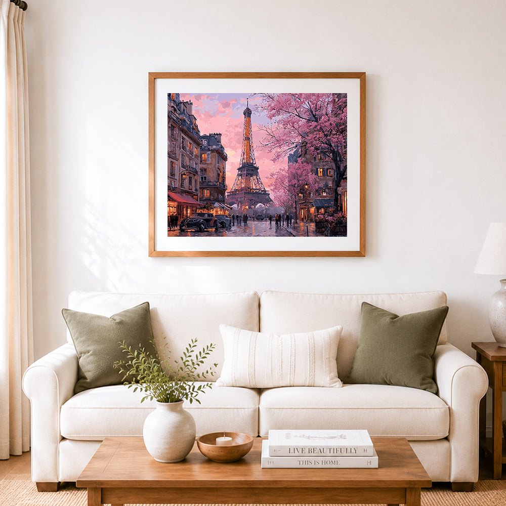 Finished cherry blossoms and eiffel tower in paris cross stitch artwork displayed as home decor