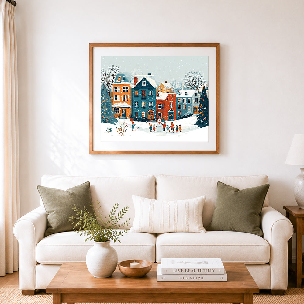 Finished children building snowman in colorful village cross stitch artwork displayed as home decor