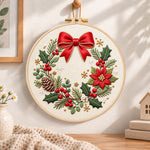 Christmas bow wreath embroidery hoop wall art displayed as warm and cozy handmade home decor