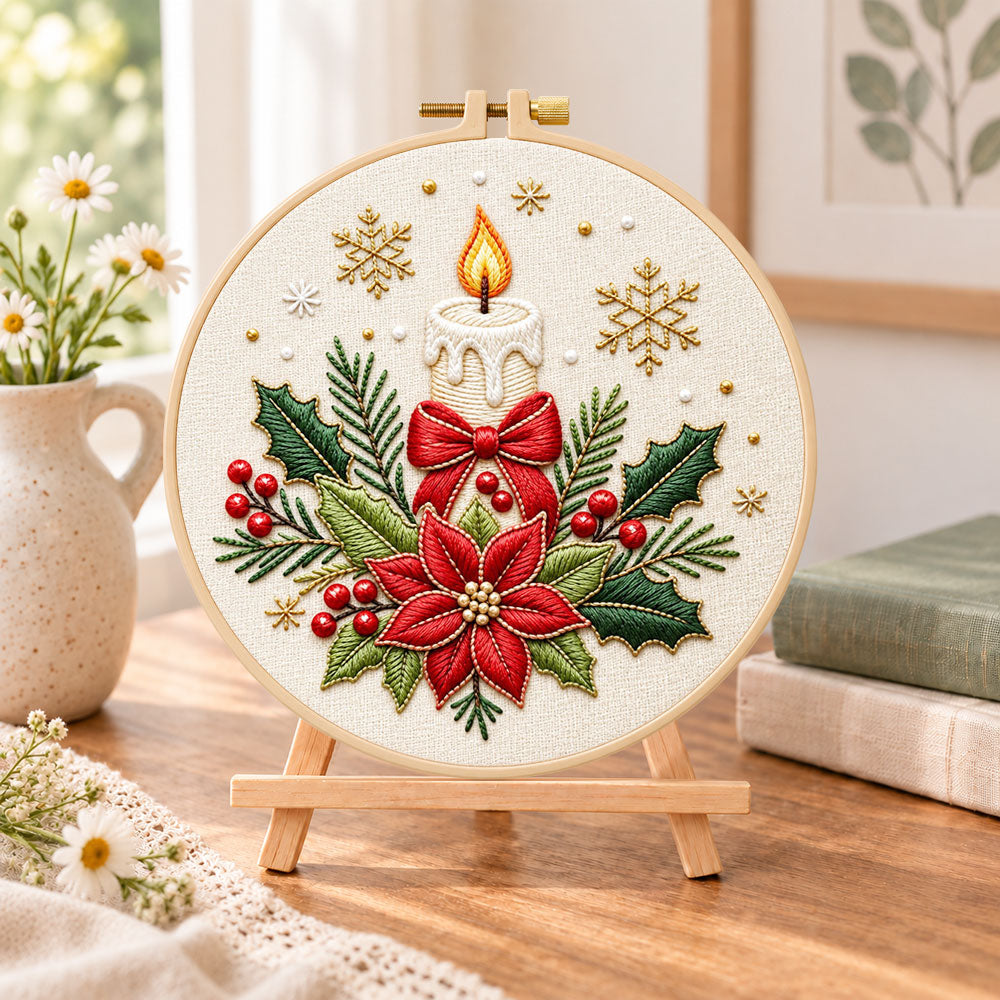 Christmas candle poinsettia embroidery kit finished hoop displayed on a wooden stand as cozy tabletop decor