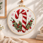 Christmas candy cane embroidery hoop wall art displayed as warm and cozy handmade home decor