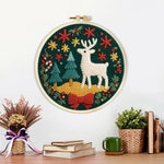 Finished christmas decorations and reindeer artwork displayed on a wall