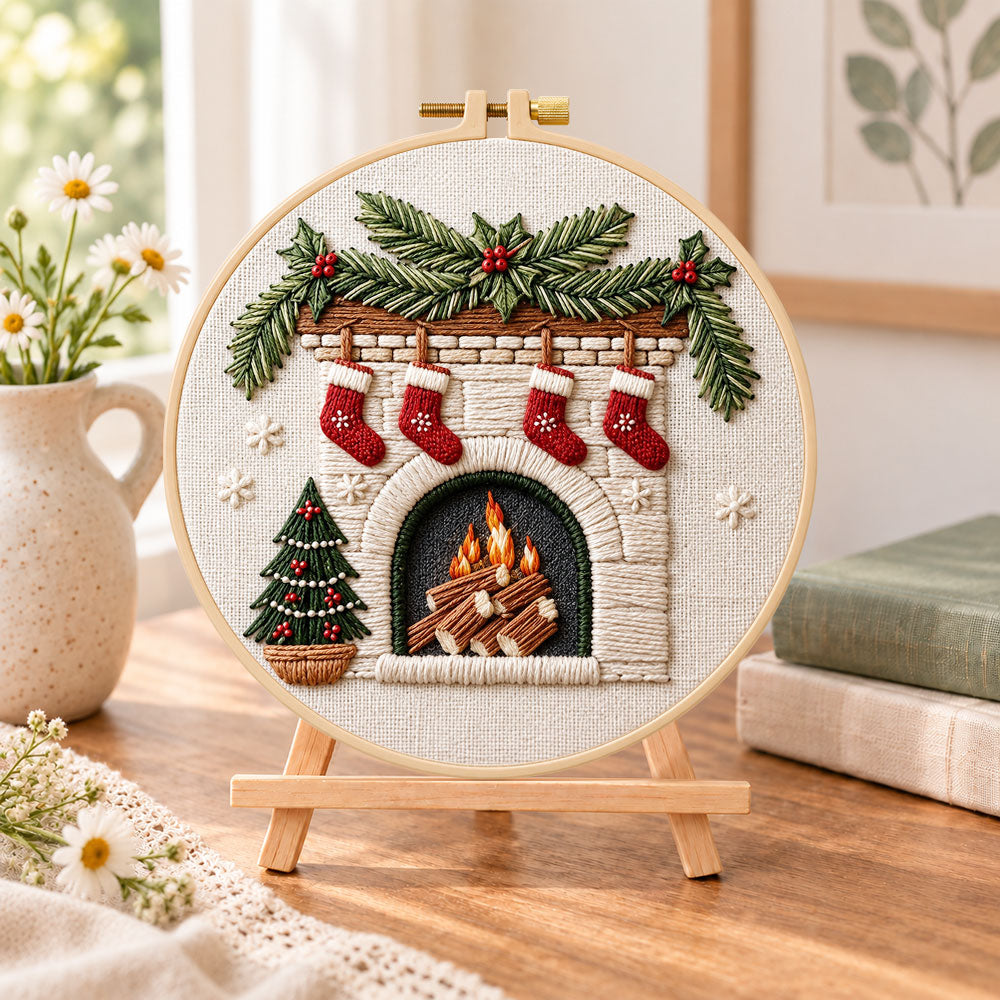 Christmas fireplace embroidery kit finished hoop displayed on a wooden stand as cozy tabletop decor