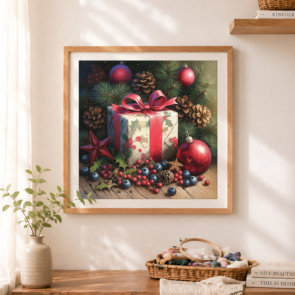 Finished christmas gift and pinecones cross stitch artwork displayed as home decor