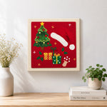 Finished christmas hat and gifts artwork displayed on a wall