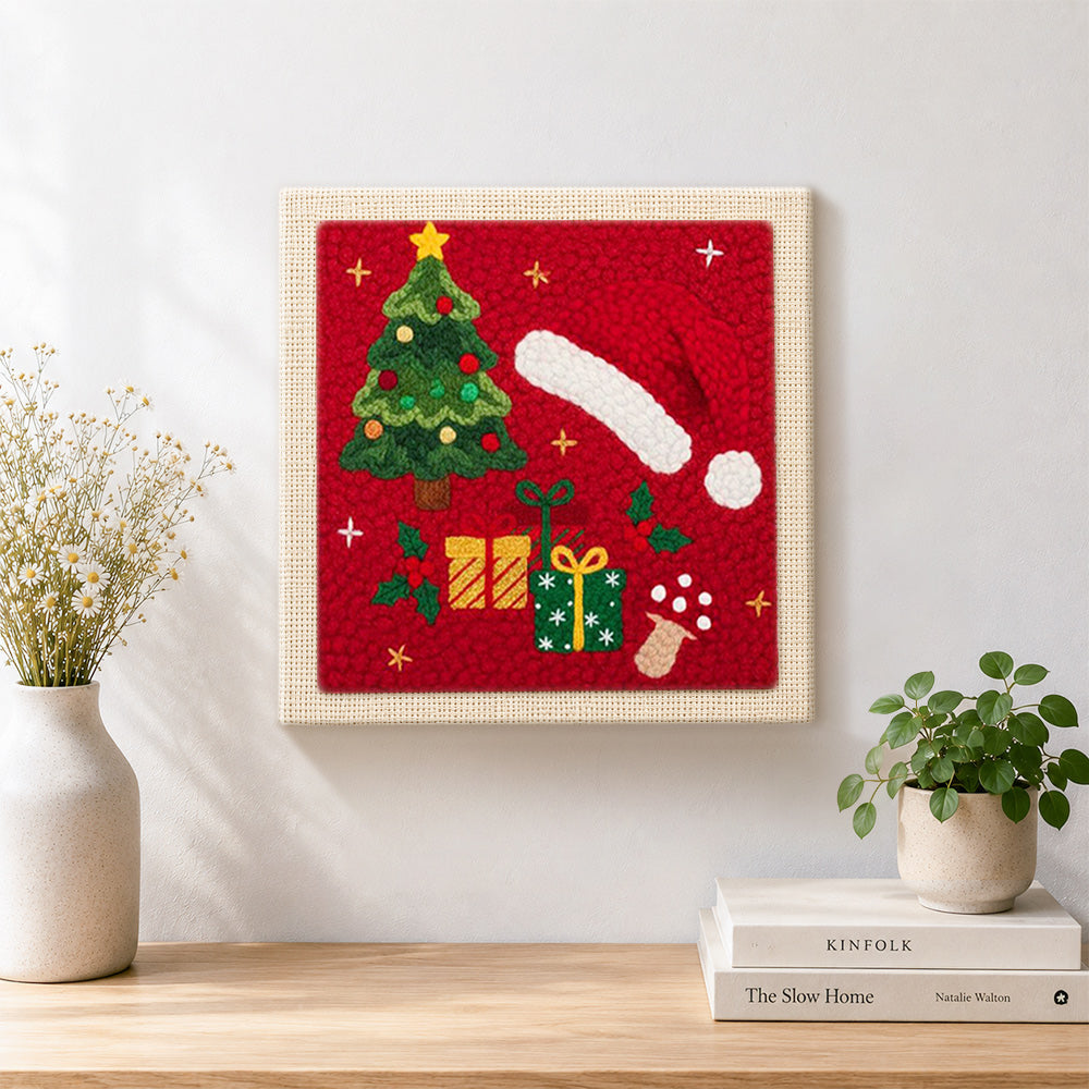 Finished christmas hat and gifts artwork displayed on a wall