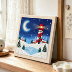 Christmas lighthouse scene punch needle artwork displayed on a table