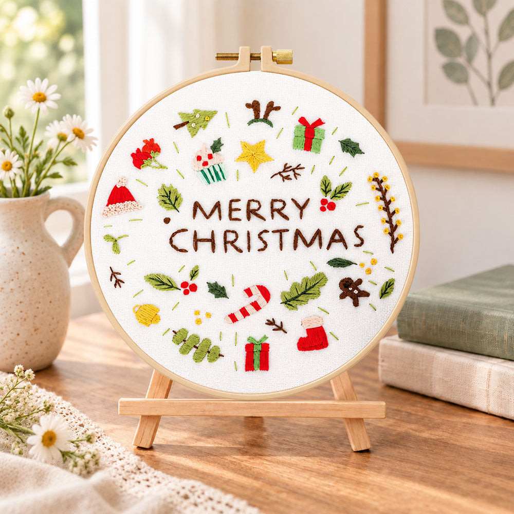 Christmas mini icons embroidery kit finished hoop displayed on a wooden stand as cozy tabletop decor