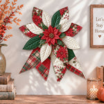 Christmas poinsettia quilted bow displayed as handmade wall decor in a cozy home