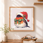 Finished christmas robin bird cross stitch artwork displayed as home decor