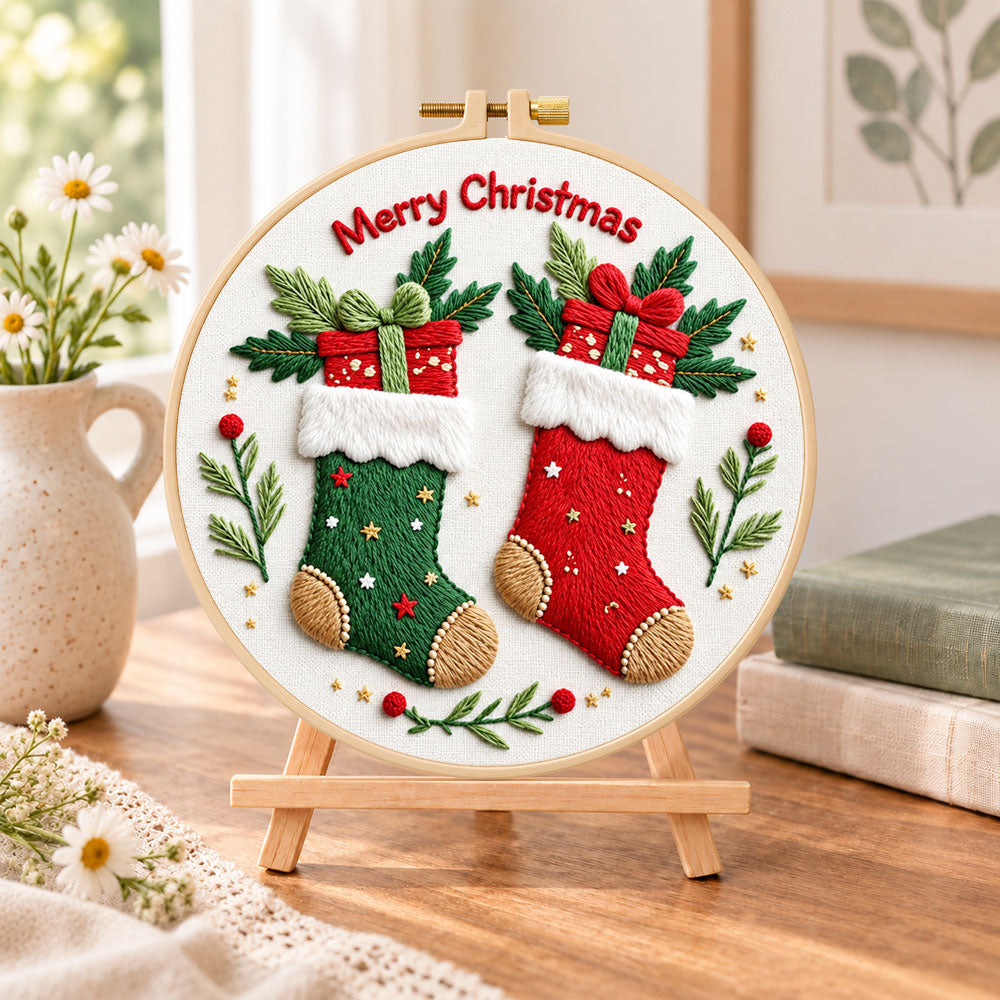 Christmas stocking cheer embroidery kit finished hoop displayed on a wooden stand as cozy tabletop decor