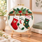 Christmas stocking decor embroidery kit finished hoop displayed on a wooden stand as cozy tabletop decor