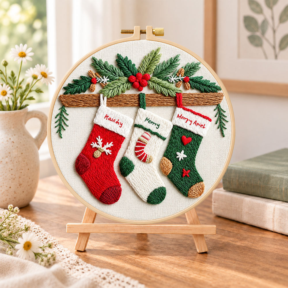 Christmas stocking decor embroidery kit finished hoop displayed on a wooden stand as cozy tabletop decor