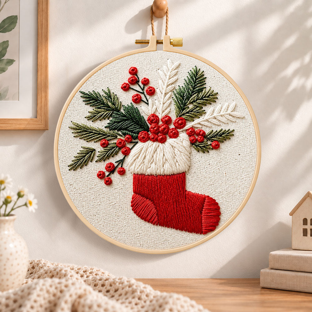 Christmas stocking embroidery hoop wall art displayed as warm and cozy handmade home decor