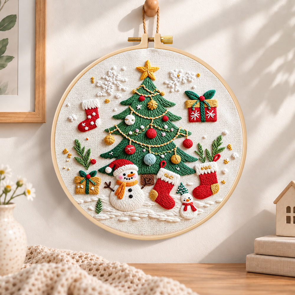 Christmas tree and snowman embroidery hoop wall art displayed as warm and cozy handmade home decor