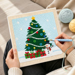 Creating handmade christmas tree and snowman punch needle artwork