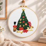 Christmas tree and toys embroidery hoop wall art displayed as warm and cozy handmade home decor