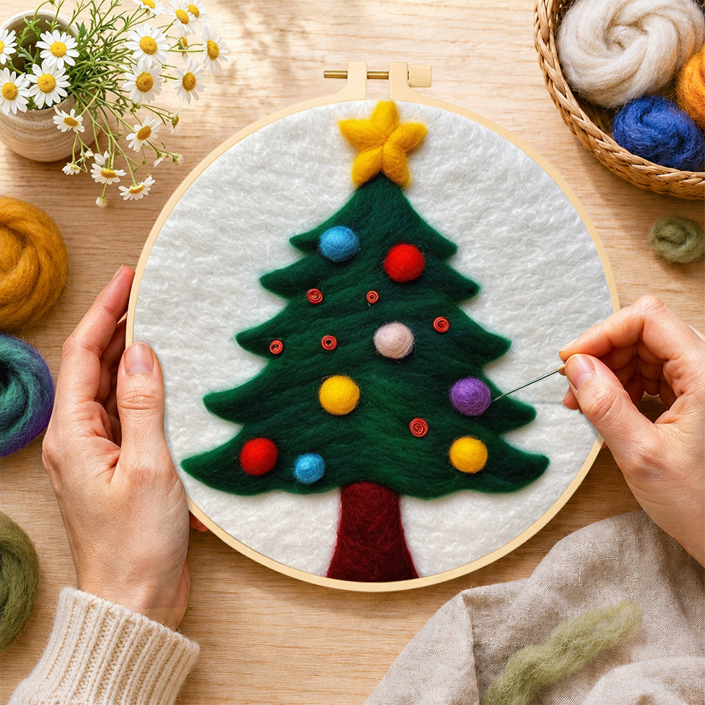 Creating the christmas tree with colorful baubles wool painting by hand with a felting needle