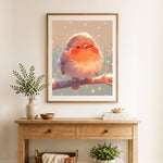 Finished chubby bird in winter snow cross stitch artwork displayed as home decor