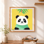 Finished chubby little panda cross stitch artwork displayed as home decor