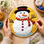 Creating the classic red and yellow striped scarf snowman wool painting by hand with a felting needle