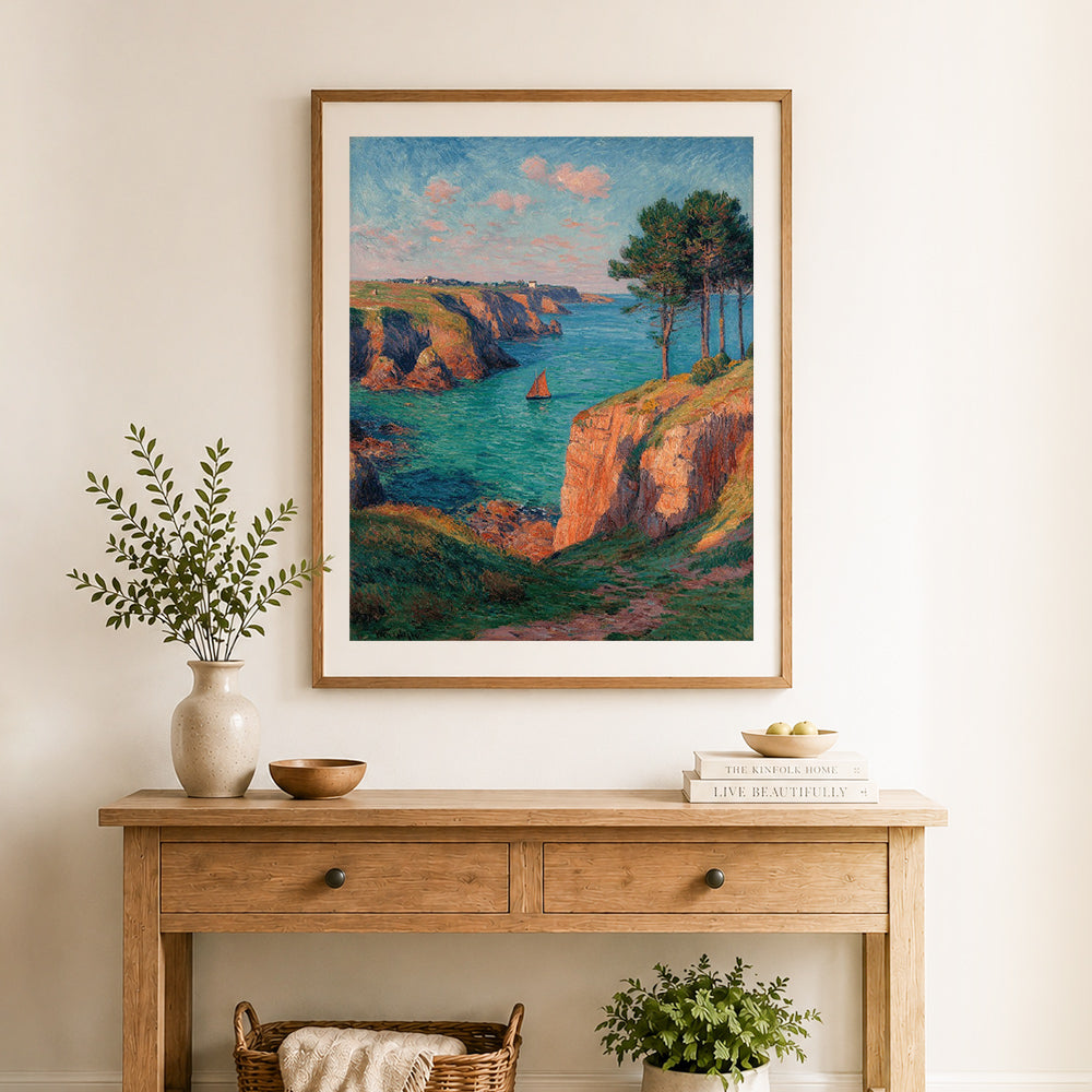 Finished cliffside ocean sailboat cross stitch artwork displayed as home decor