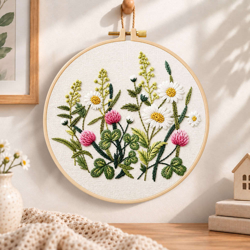 Clover and daisy floral embroidery hoop wall art displayed as warm and cozy handmade home decor