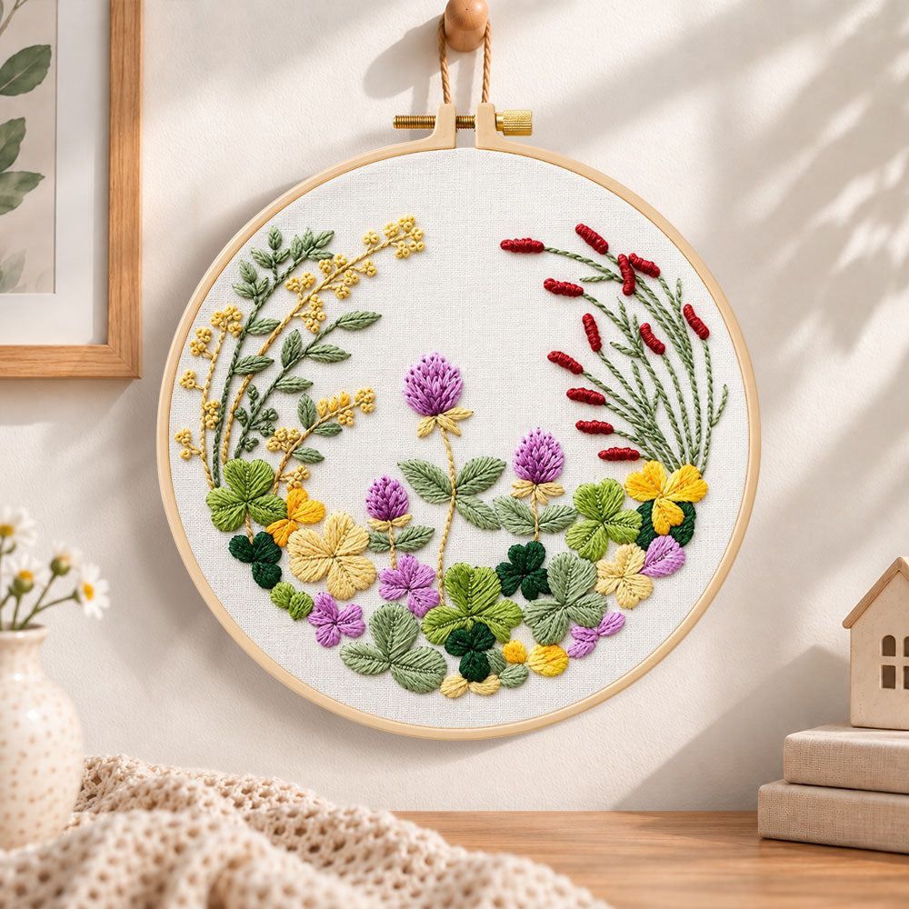 Clover floral wreath embroidery hoop wall art displayed as warm and cozy handmade home decor