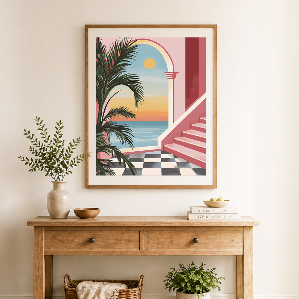 Finished coastal arch sunset view cross stitch artwork displayed as home decor