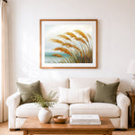Finished coastal pampas grass view cross stitch artwork displayed as home decor