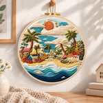Coastal sunset cove embroidery hoop wall art displayed as warm and cozy handmade home decor