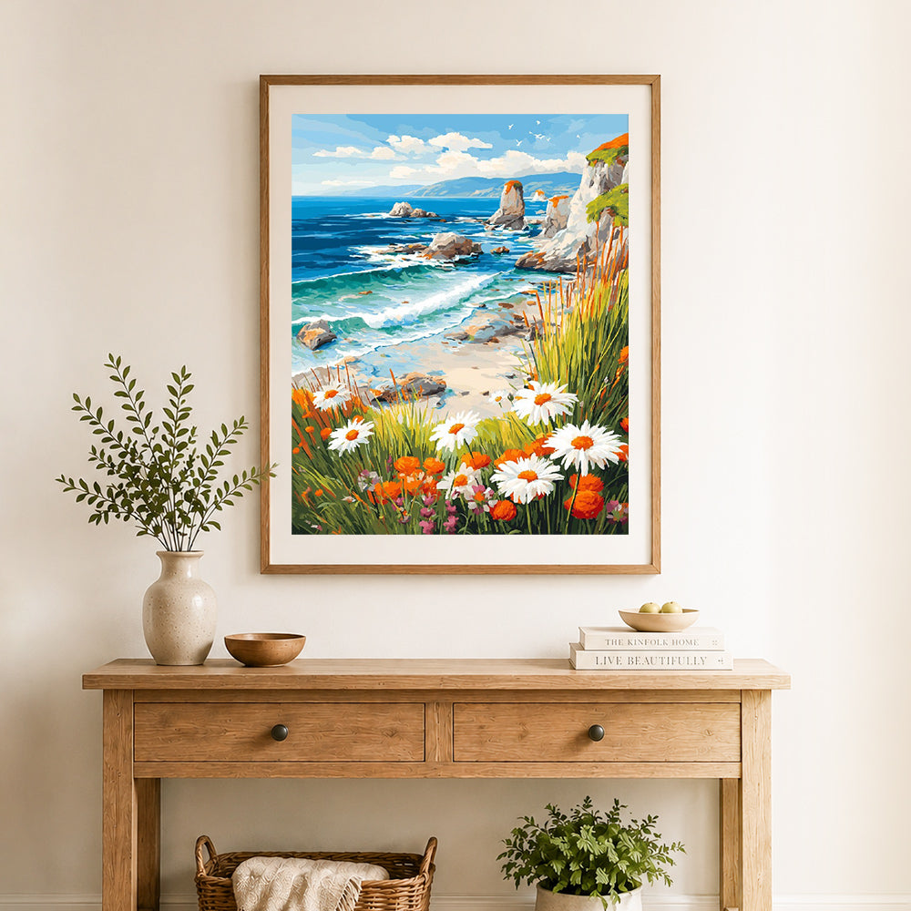 Finished coastal wildflower shore cross stitch artwork displayed as home decor