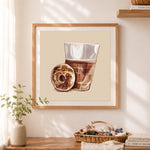 Finished coffee and bagel art cross stitch artwork displayed as home decor