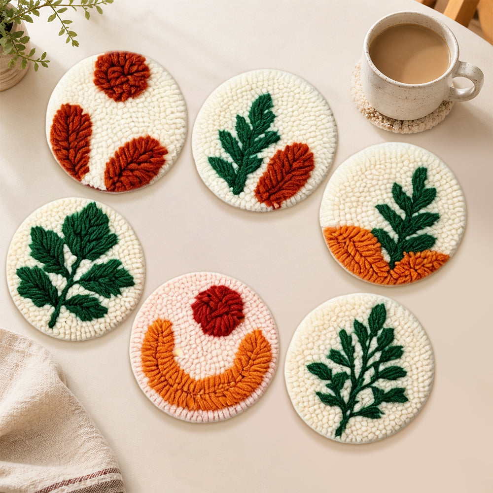 Color-block botanical punch needle coasters used for home decoration