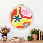 Finished colorful abstract flowers artwork displayed on a wall