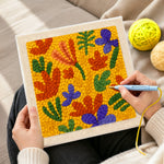 Creating handmade colorful abstract petals punch needle artwork