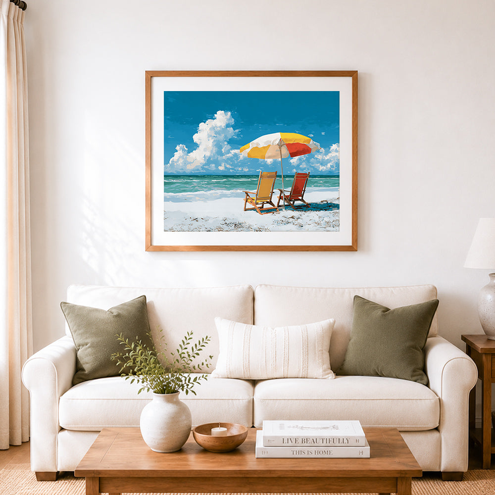 Finished colorful beach umbrella and lounge chairs cross stitch artwork displayed as home decor