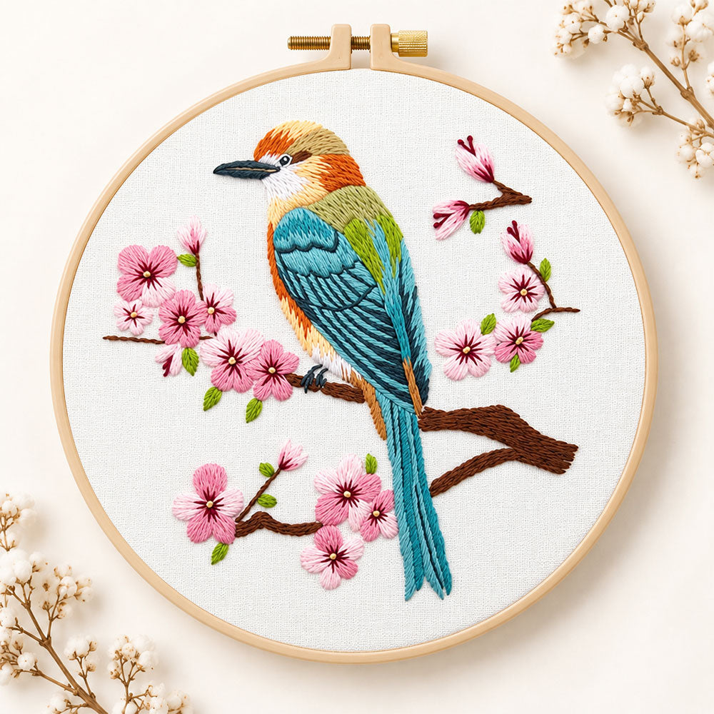 Colorful bird amid pink cherry blossoms embroidery kit