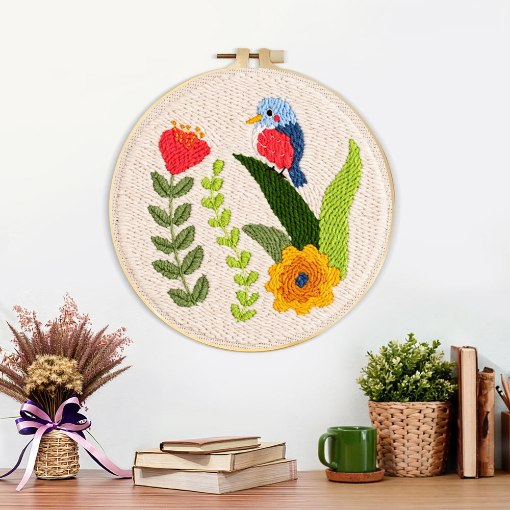 Finished colorful bird and flowers artwork displayed on a wall
