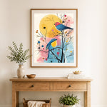 Finished colorful birds on bare branches cross stitch artwork displayed as home decor