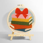Colorful book stack with bow punch needle kit for beginners