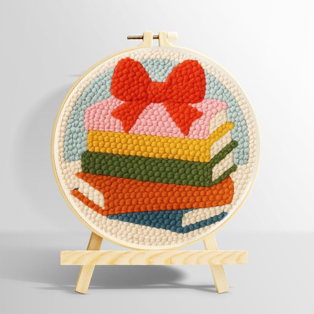 Colorful book stack with bow punch needle kit for beginners
