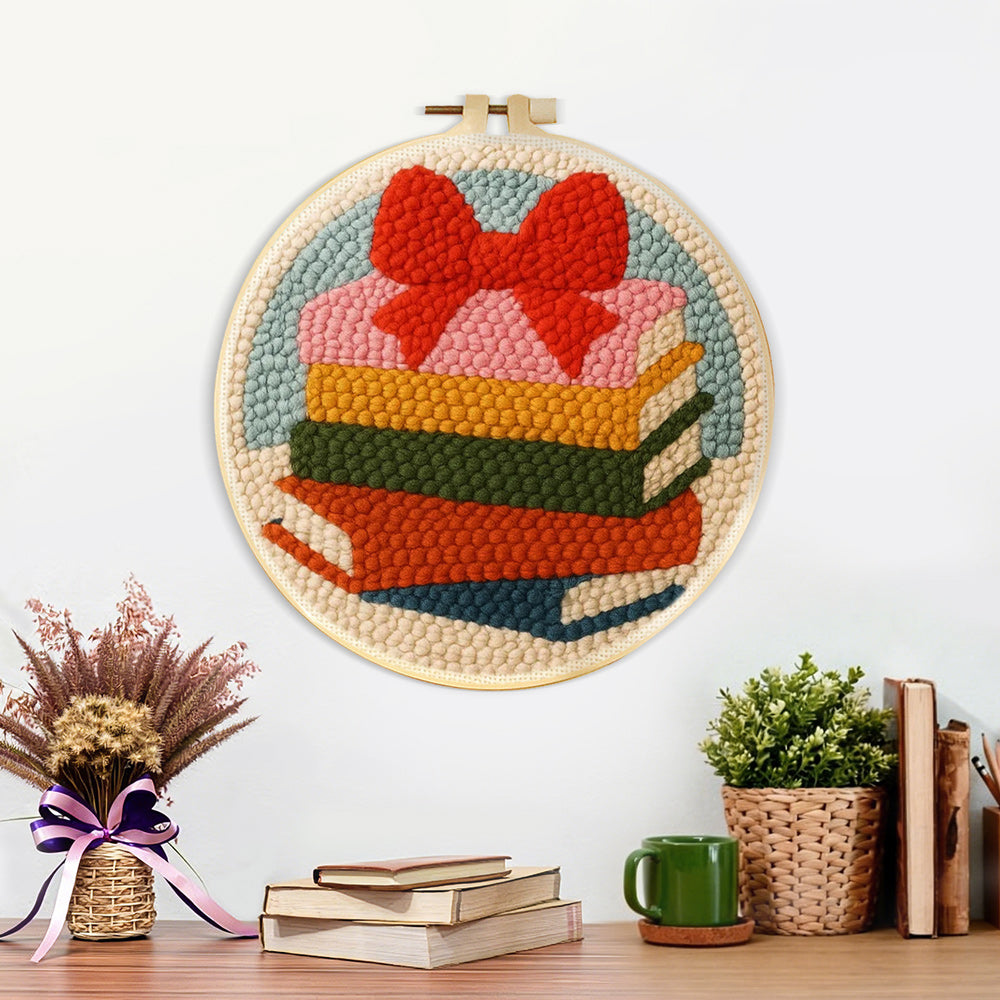 Finished colorful book stack with bow artwork displayed on a wall