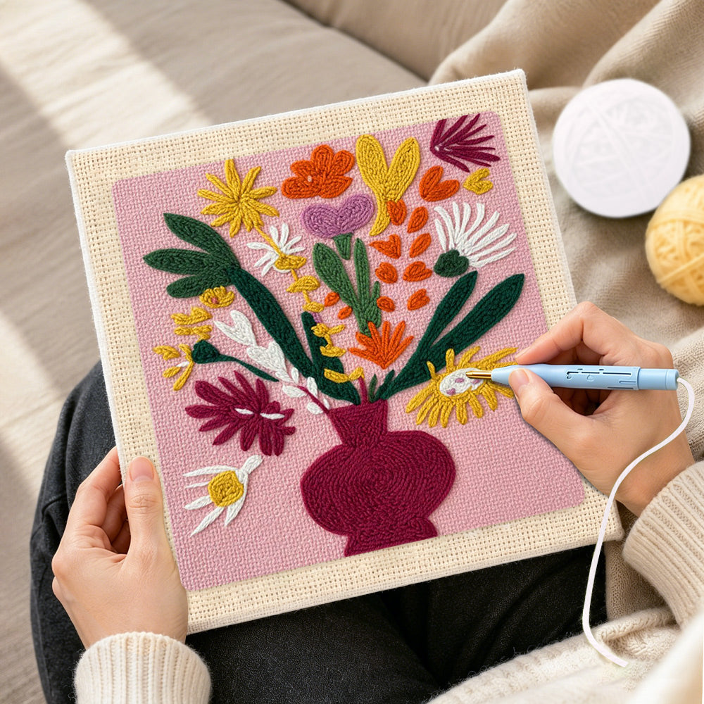 Creating handmade colorful bouquet in burgundy vase punch needle artwork