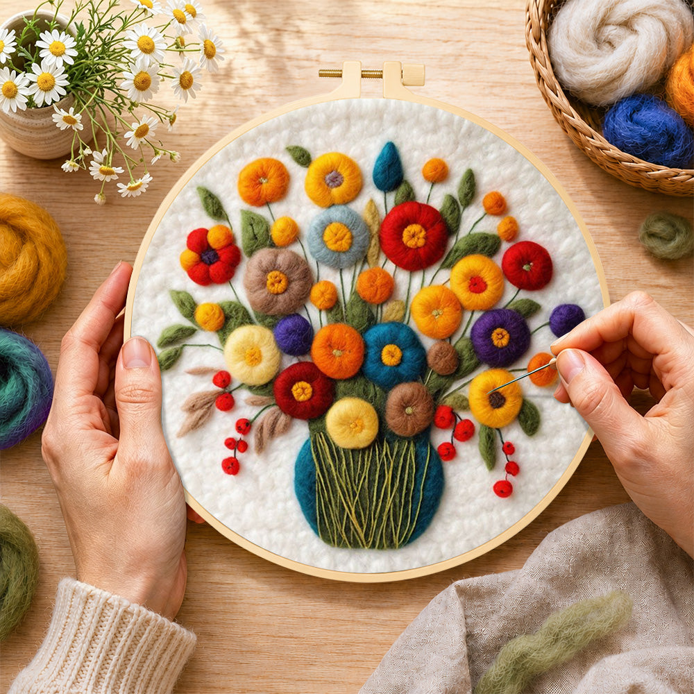 Creating the colorful bouquet with berries wool painting by hand with a felting needle