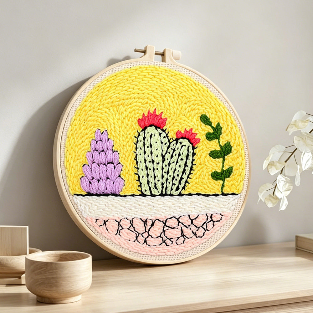 Colorful cacti garden punch needle artwork displayed on a table