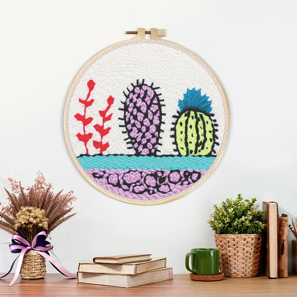 Finished colorful cactus trio artwork displayed on a wall