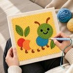 Creating handmade colorful caterpillar punch needle artwork